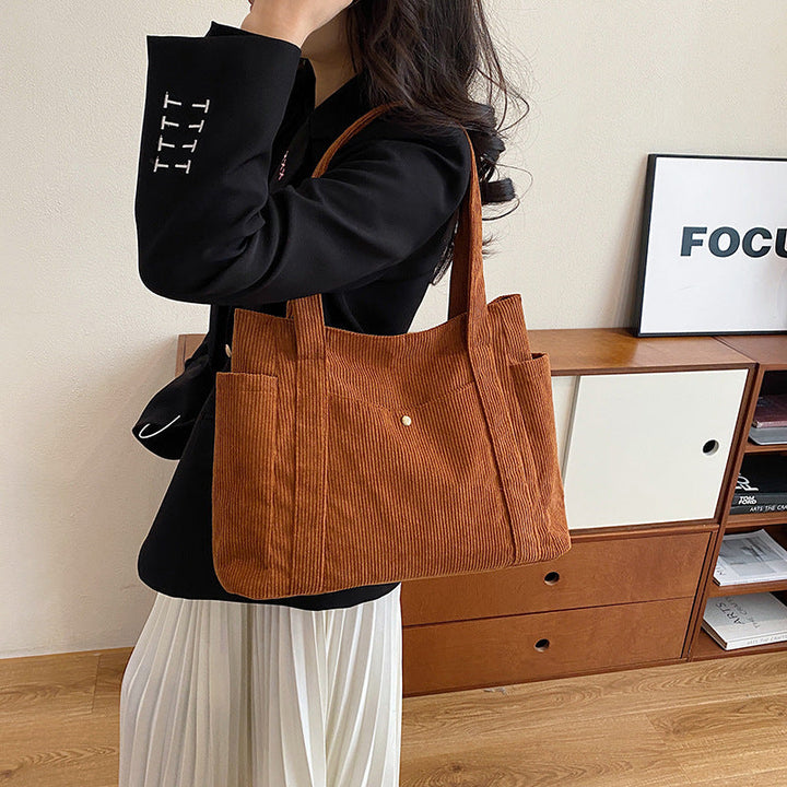 
women’s corduroy bag, corduroy tote bag, everyday women’s bag, casual tote bag for women, women’s shoulder bag, crossbody bag for women, casual everyday bag, trendy women’s tote, ribbed fabric bag, lightweight shoulder bag, versatile women’s purse, daily handbag for women, corduroy fabric handbag, soft corduroy tote, ribbed corduroy shoulder bag, textured fabric bag, eco-friendly corduroy bag, women’s fashion bag, stylish tote bag for women, chic everyday purse, minimalist women’s bag, modern casual handba